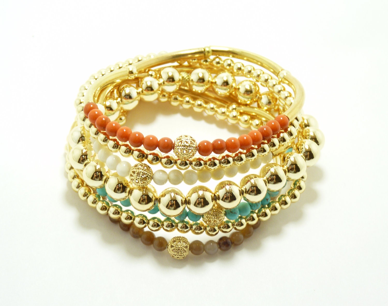 7 strand stretchable stack bracelets with tropical color in gold. By Simply Uniq Fashion Bracelet.