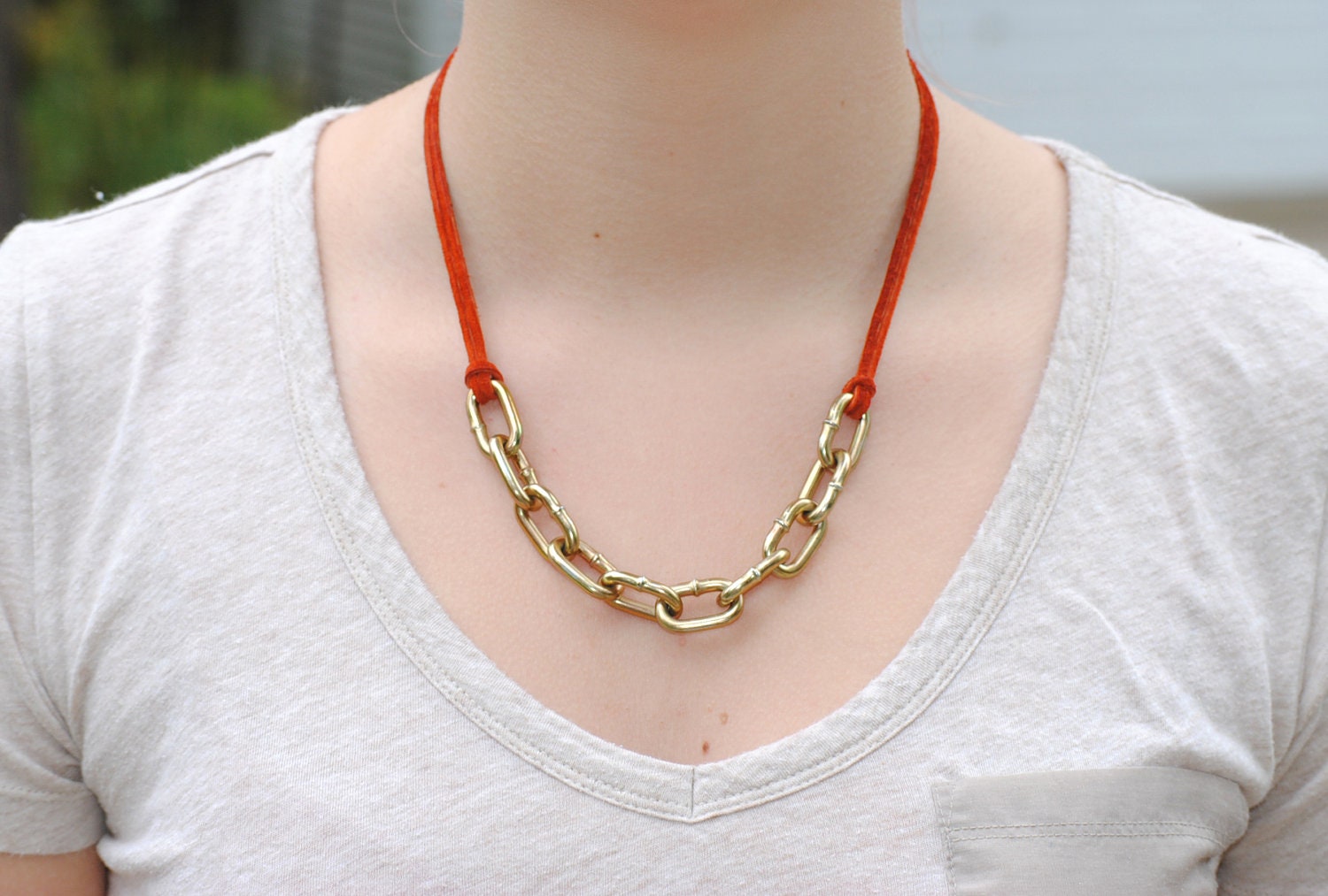 Chain and orange leather necklace