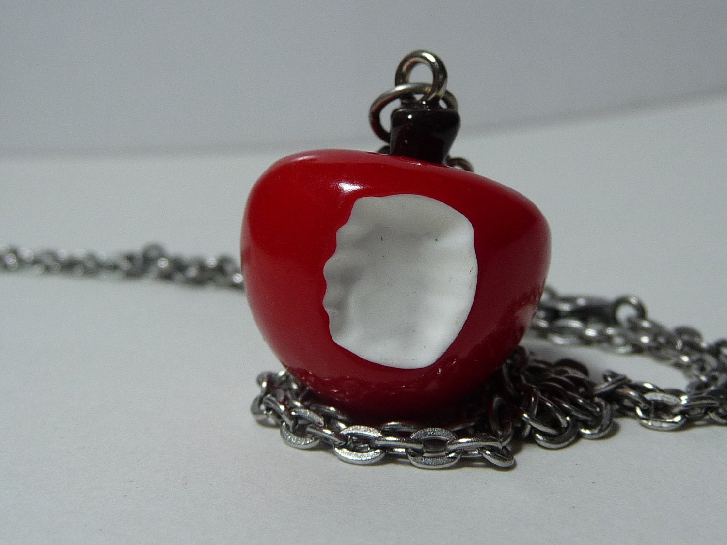 Snow White's Bitten Apple necklace by vintagerust