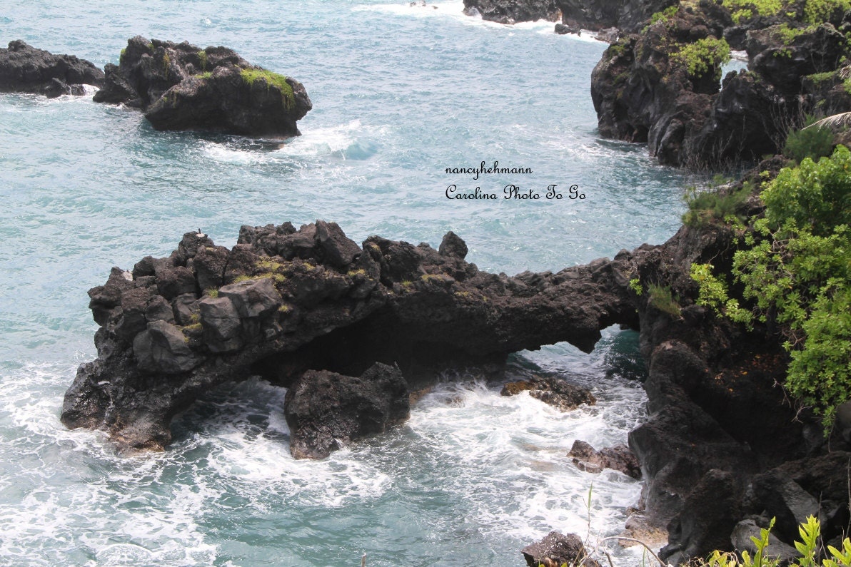 Swirling ocean around volcanic rock off the coast of Maui, Hawaii, high definition photography