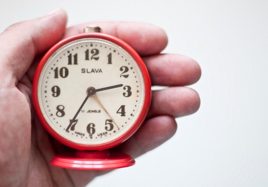 Vintage red mechanical alarm clock "Slava"