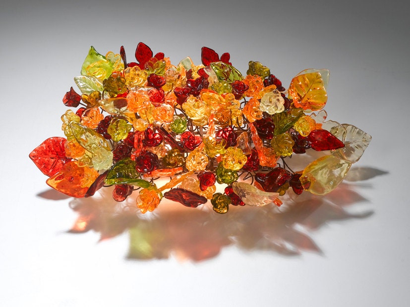 Wall lighting. Warm colors of flowers and leaves.