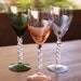 Vintage colored wine glasses with a spiral stem.