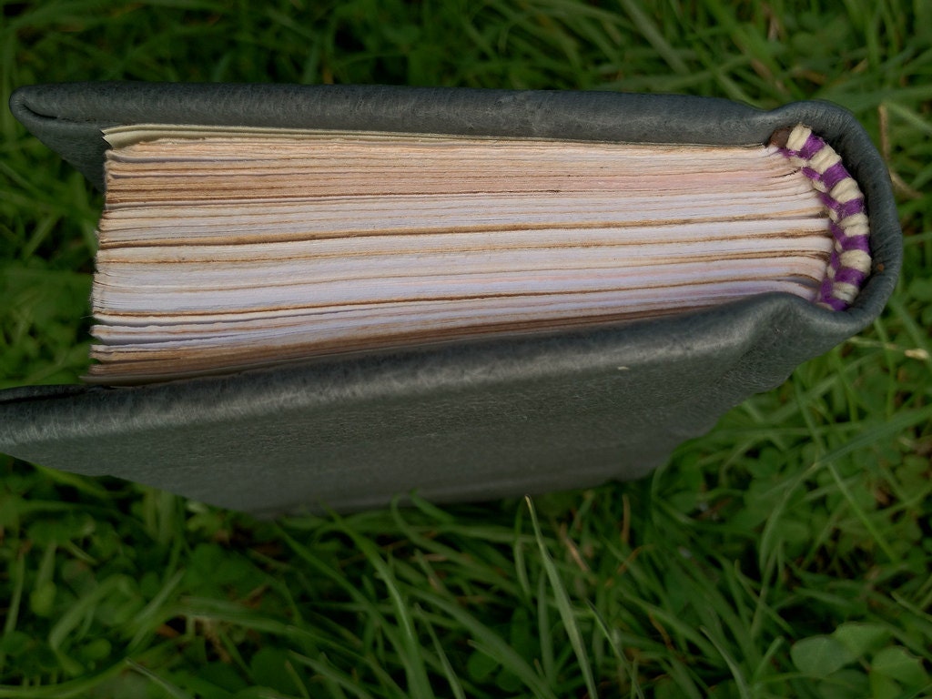 Leather journal, pocket sized with lined paper handbound with embossed cover