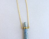 Gold long chain necklace with a kyanite blue stone point, long pendant