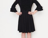 Black Tuxedo style dress with bell sleeves and pleats