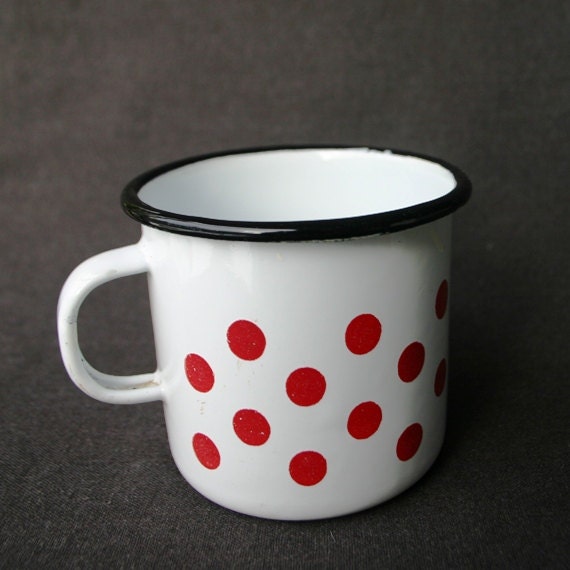 Red polka dots and white vintage enamel cup.