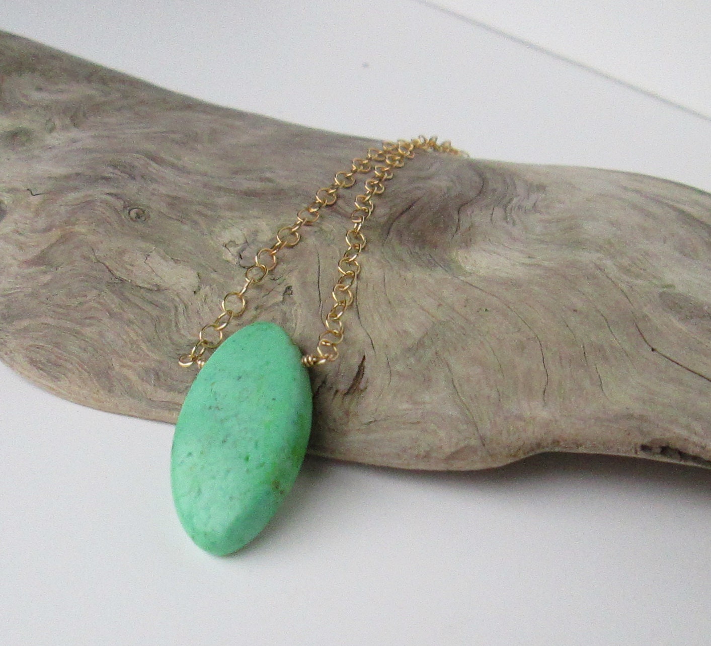 Mint Apple Green Howlite Marquise Pendant. Gold plated chain.