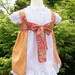 Knot Top Pinafore Dress in yummy orange 6-12m