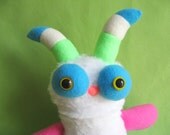 Monster toy stuffed animal plush with striped horns