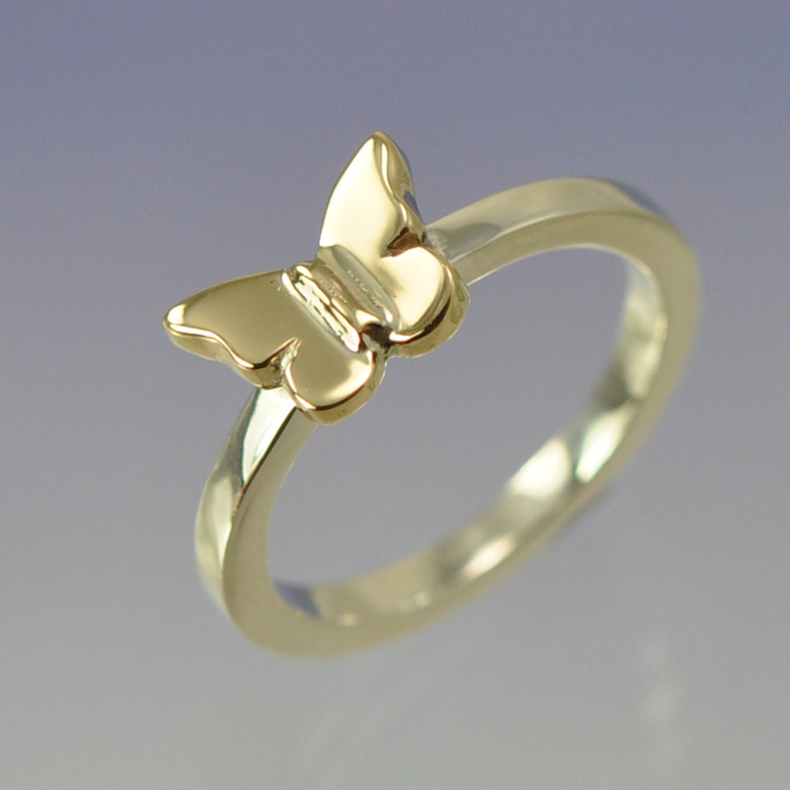 9k Yellow Gold Butterfly on a Sterling Silver Ring.