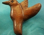 Wood carving of a Stylized  Hummingbird Pin in Wallnut