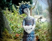 Ceramic Santo Sculpture holding  Hope heart
