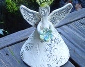 Ceramic Fairy Sculpture holding flower