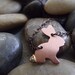 Mini bunny pendant with a raw chocolate diamond tail