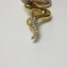 Beautiful vintage 80s gold tone and rhinestone snake brooch