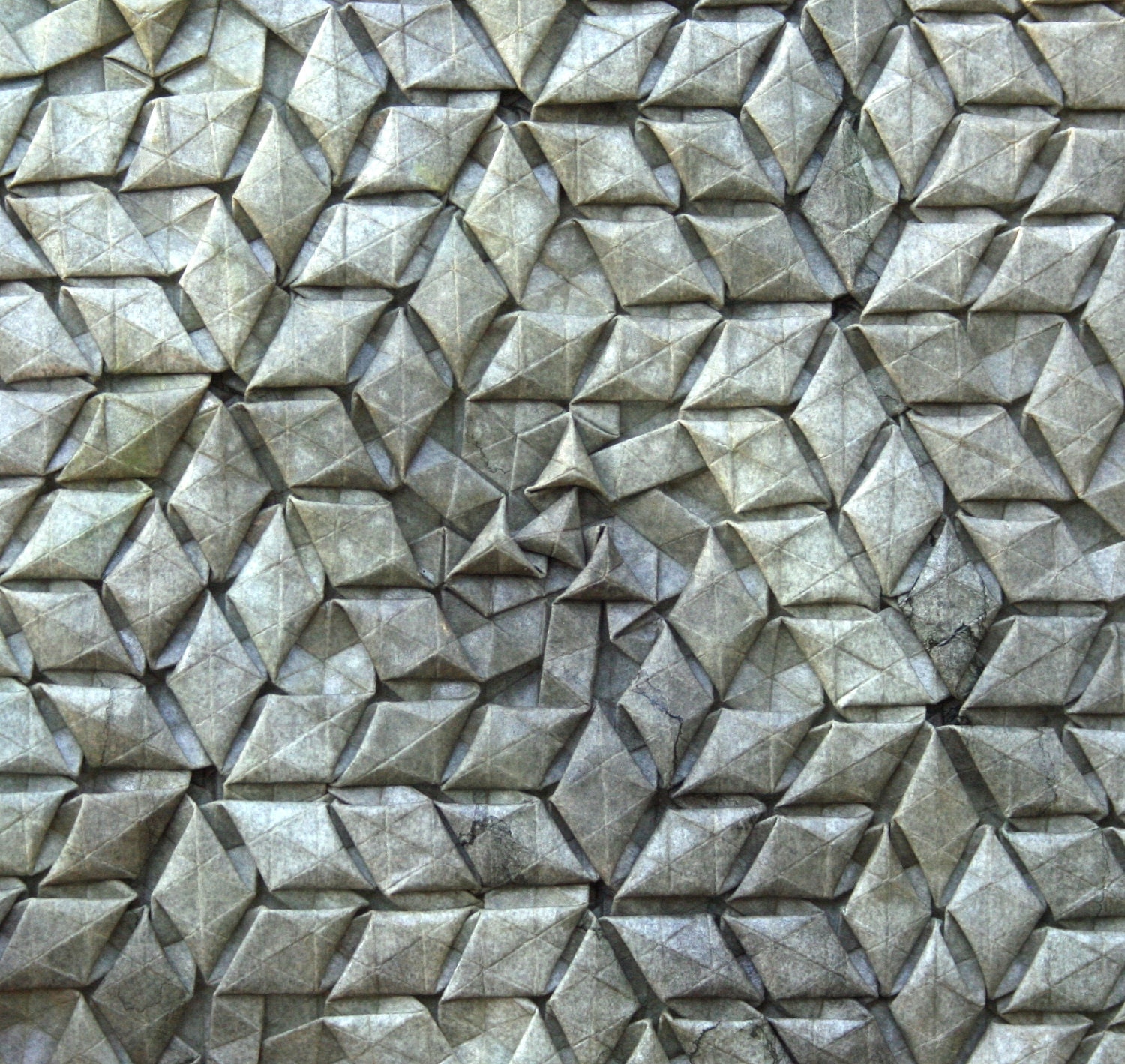 Strange symmetry - complex origami tessellation