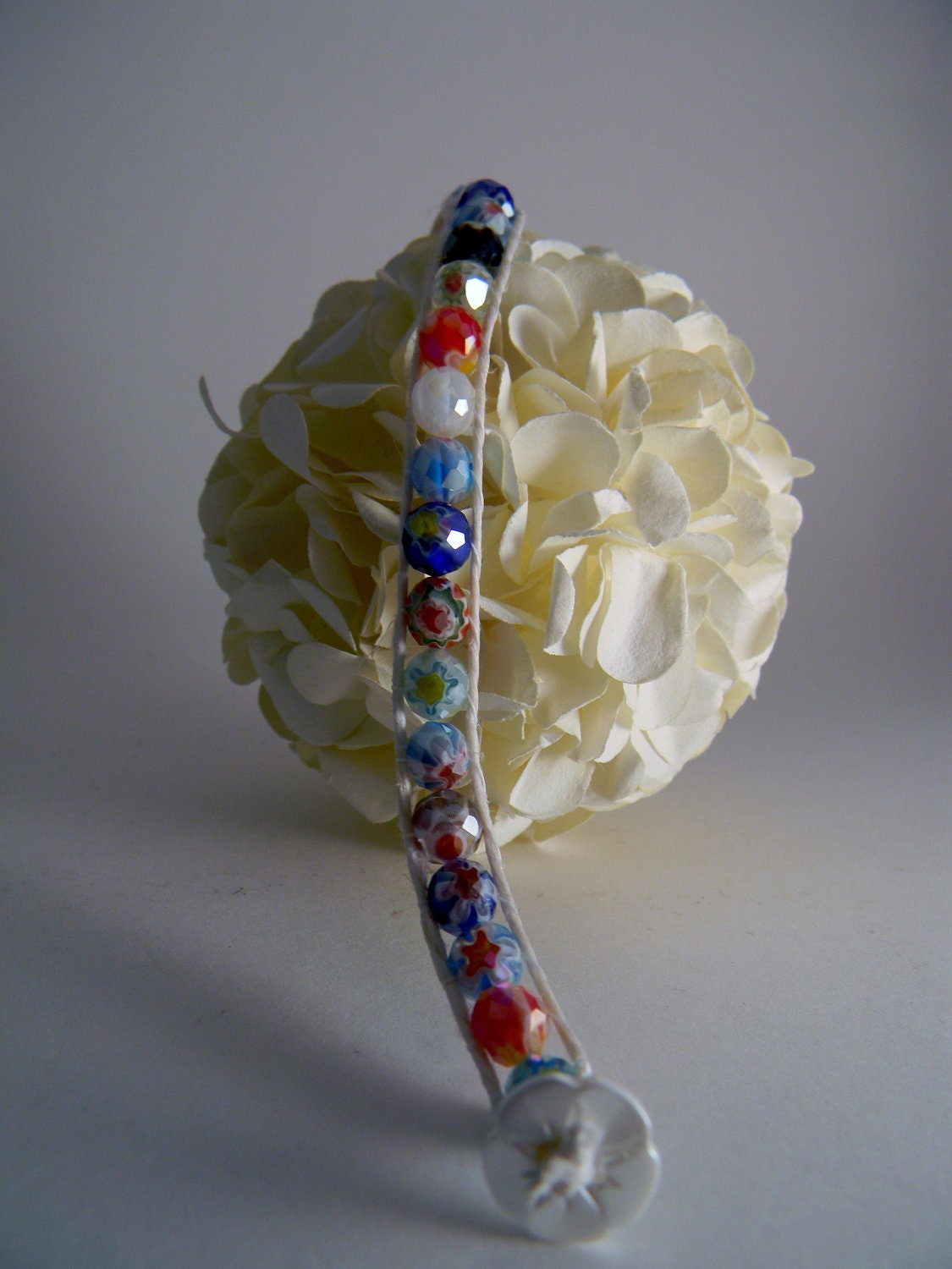 handmade hemp and faceted millefiori glass bracelet with flower button clasp