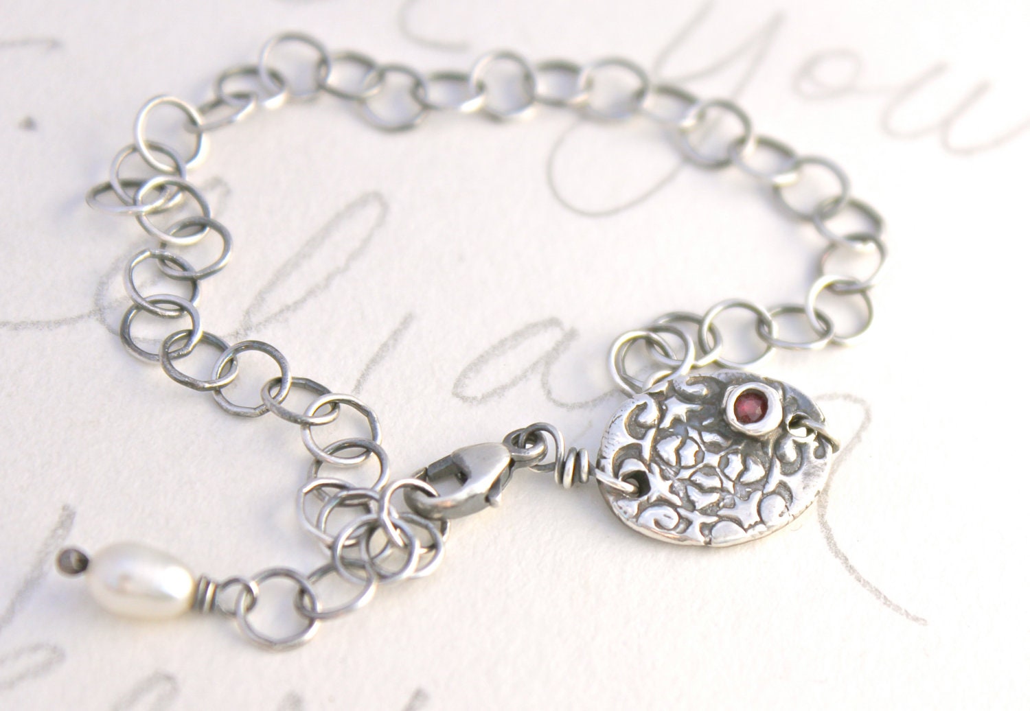 sterling silver ruby charm bracelet . recycled sterling silver peace bracelet . tudor rose bracelet by peacesofindigo