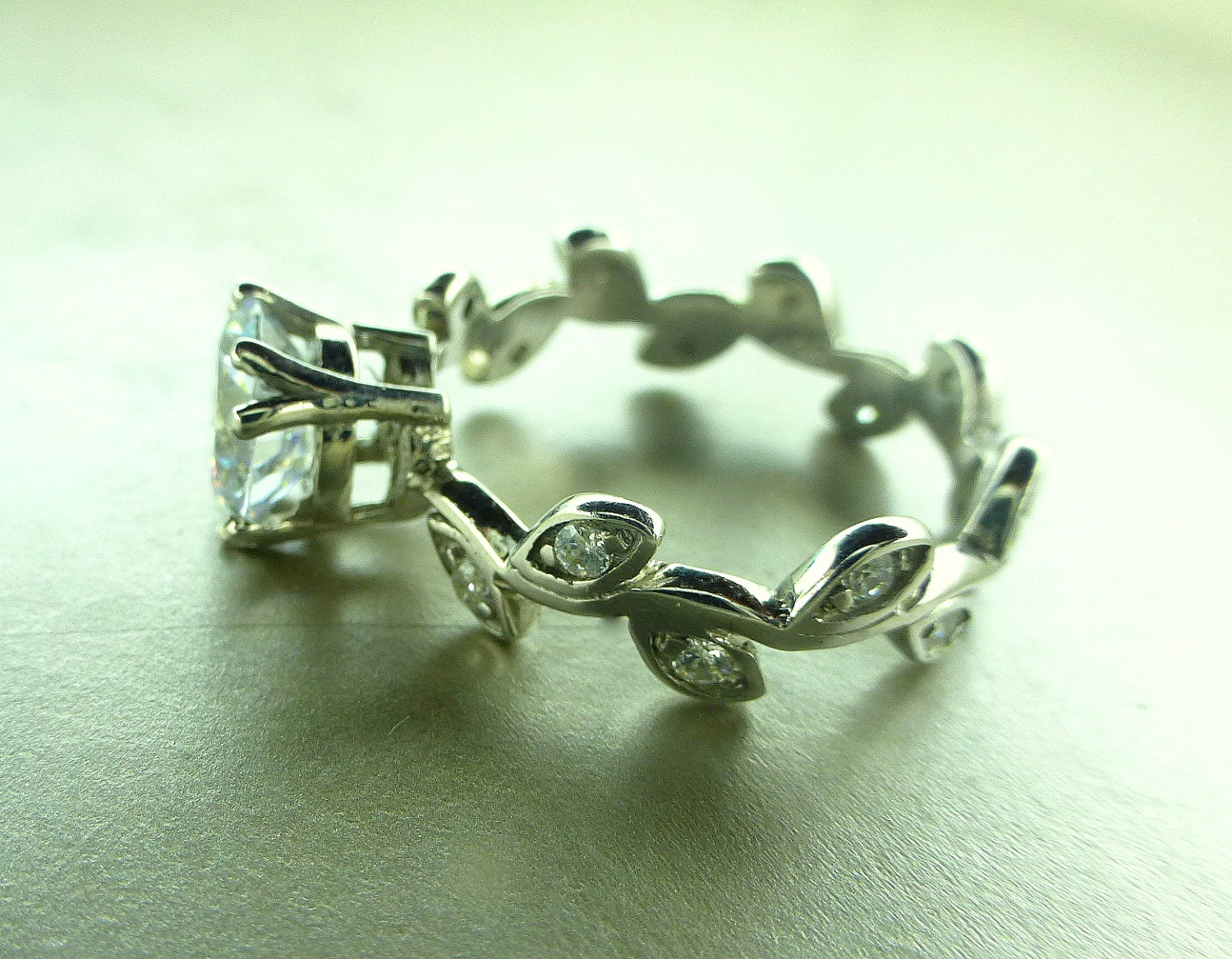 Leaf engagement ring. Moissanite center stone.