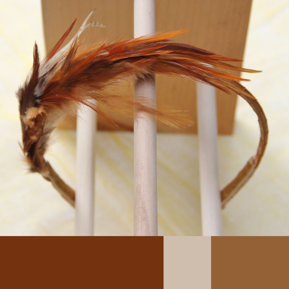 Bright amber to honey brown feathers with copper ribbon. Comfortable and flexible. Natural fascinator. 0117