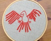 cave-drawing inspired red bird stitching