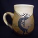 Listing for Russell Broomhall Kokopelli Stoneware Mug - Southwestern Stoneware Mugs