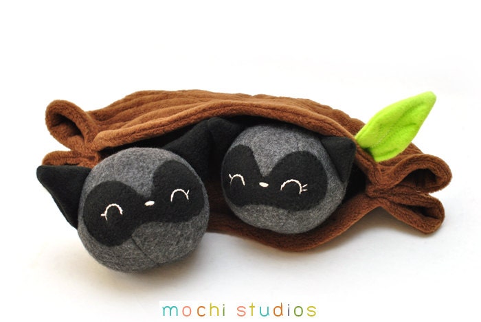 Two Raccoons in a Log Plush