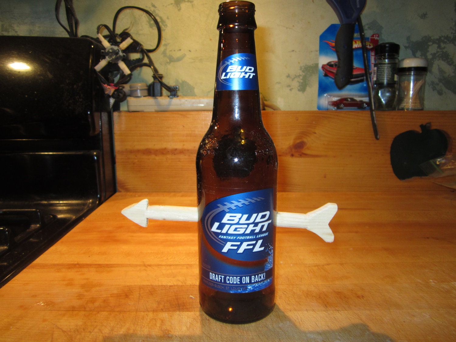 bottle, wood, stuck, weird, odd, different, conversational, beer, bar, man, cave, Bud Light w/Arrow