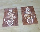 Victorian Tea Drinking Monkeys on Unicycles - The Pair - Two layer reduction woodblock print, brown and orange on cream
