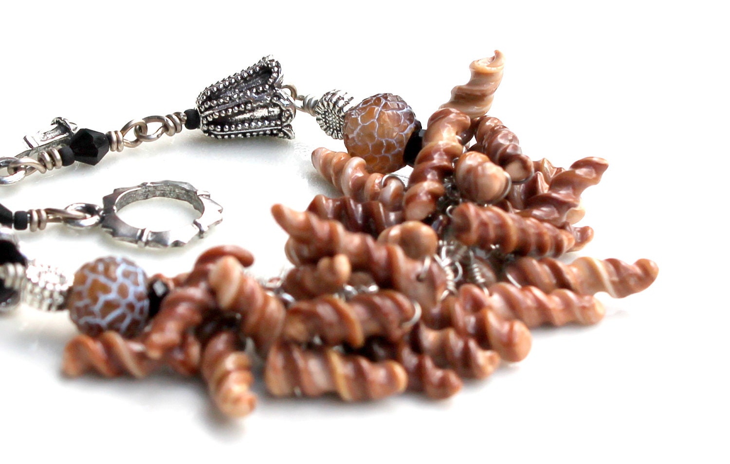 anchors away bracelet. spiral seashell wire wrapped bracelet. choco seashells. sunflowers. antiqued silver cones.
