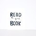 Typography print of Read a Good Book Linocut in black 8x10 on white paper