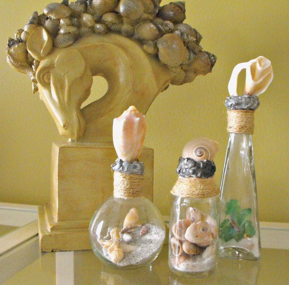 Items similar to Shell Bottle Set of Three Seashell Bottles topped