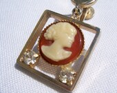 Cameo Victorian style vintage earring for upcycling. Gold setting, cream and rust with faux diamonds.