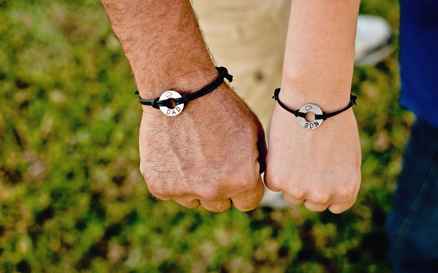 DAD/SON, matching stamped bracelets, Small Aluminum Disks Stamped with Dad and Son with a bear at the top, and adjustable cord