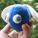 beady-eyed flying blue scrap monster