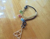 The Legend of Zelda's Wise Ear Bend with Hanging Spiritual Stones and Triforce in Black