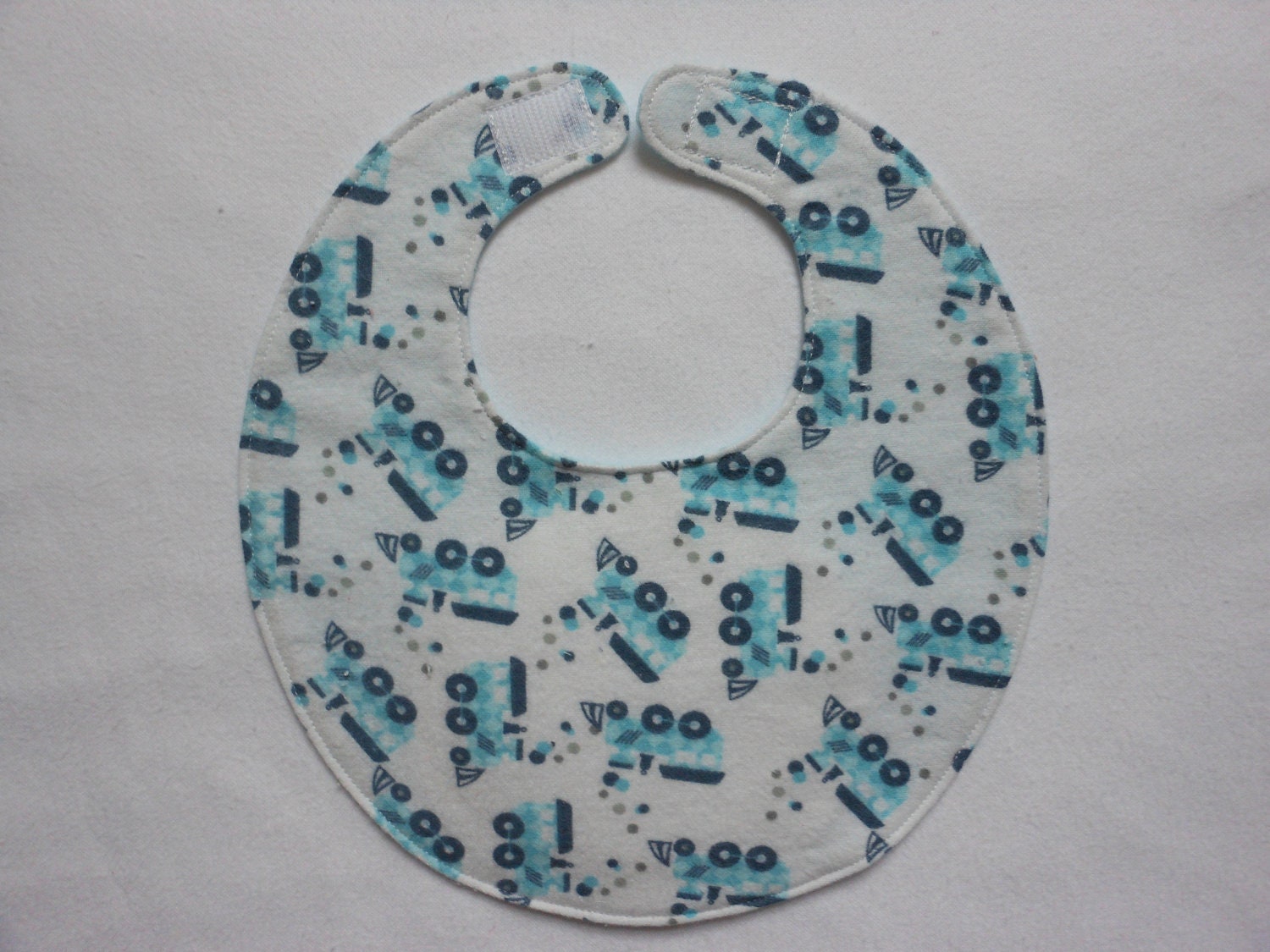 Baby Bibs, four soft layers, reversible, white with blue trains
