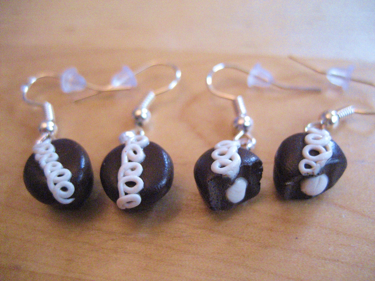 Snack cake cupcake earrings made from polymer clay.