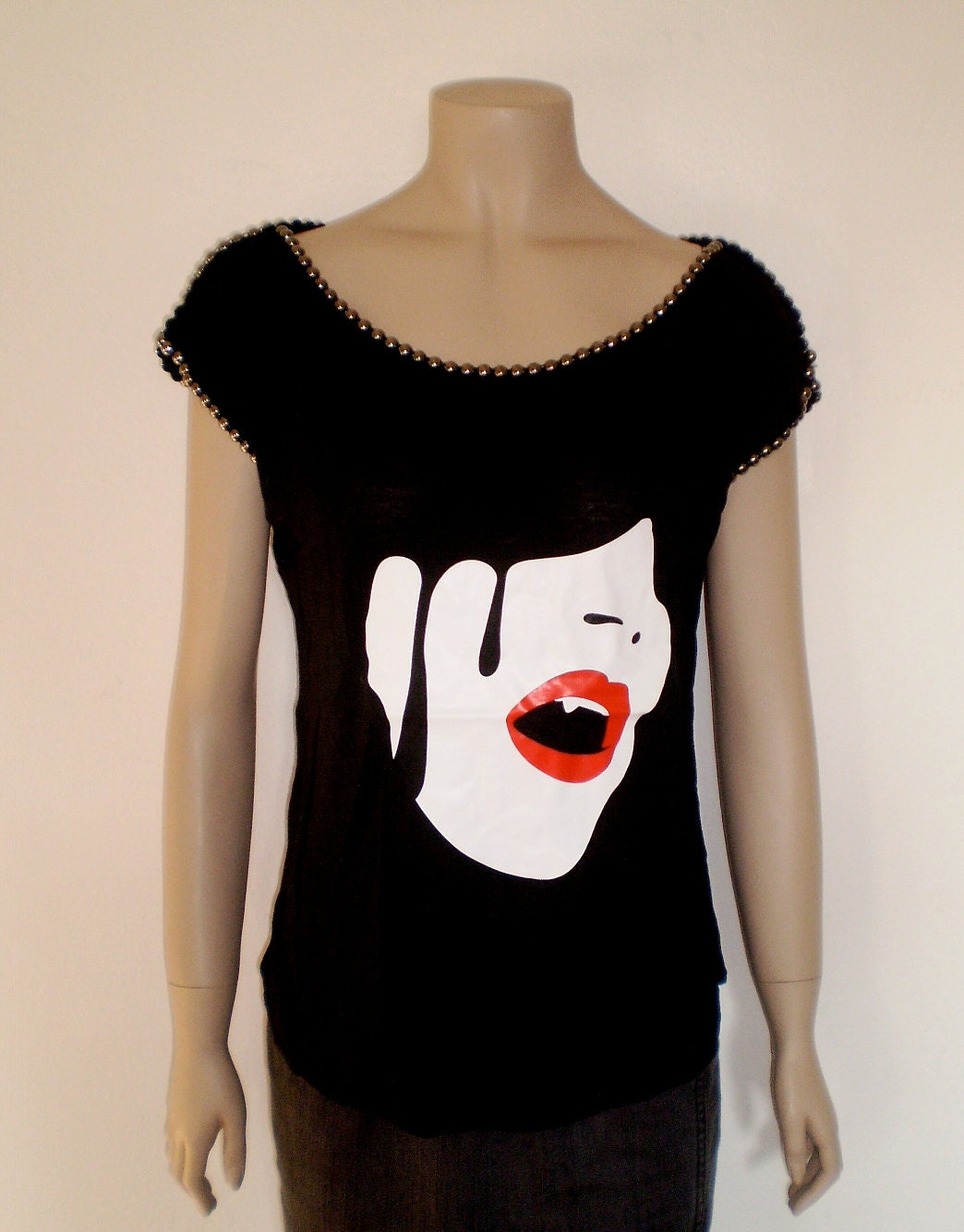 Black t-shirt for women with studs on shoulders and neck wih vampire woman face and tears