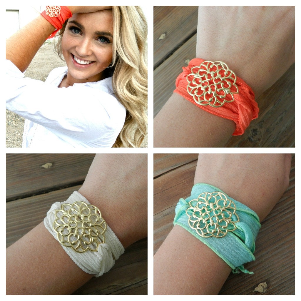 Silk wrap bracelet with gold medallion center.