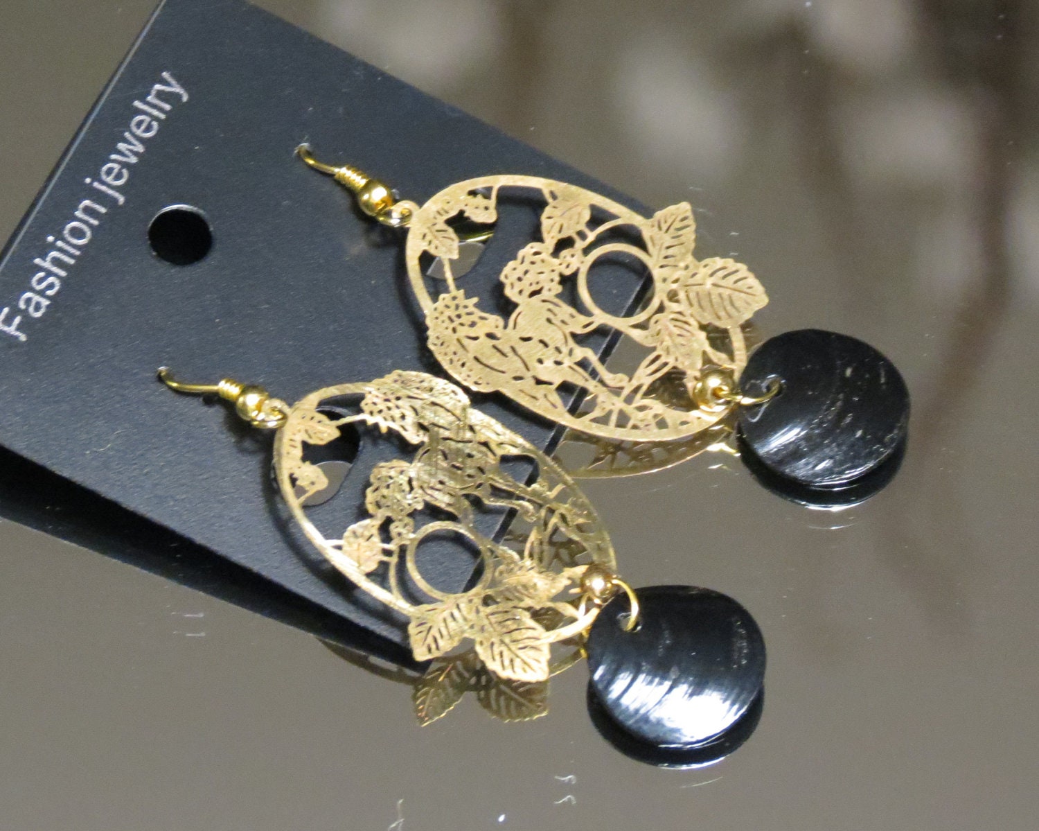 Golden Horse Earrings with black shell accent. 14k gold plated ear wires. Shiny brass charms. One of a Kind earrings