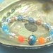 Blue and Orange Bangle Bracelet Silver Shiny Bangle Blue Flash Beads Lampwork Beads Bangle Orange Shamballa Beads Flower Beads Silver Bangle