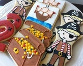 Decorated Pirate Cookies with numbers, treasure, and ships. Perfect for your child's Birthday Party favors