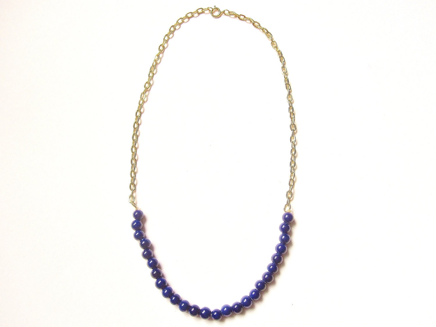 blue beaded necklace with gold chain