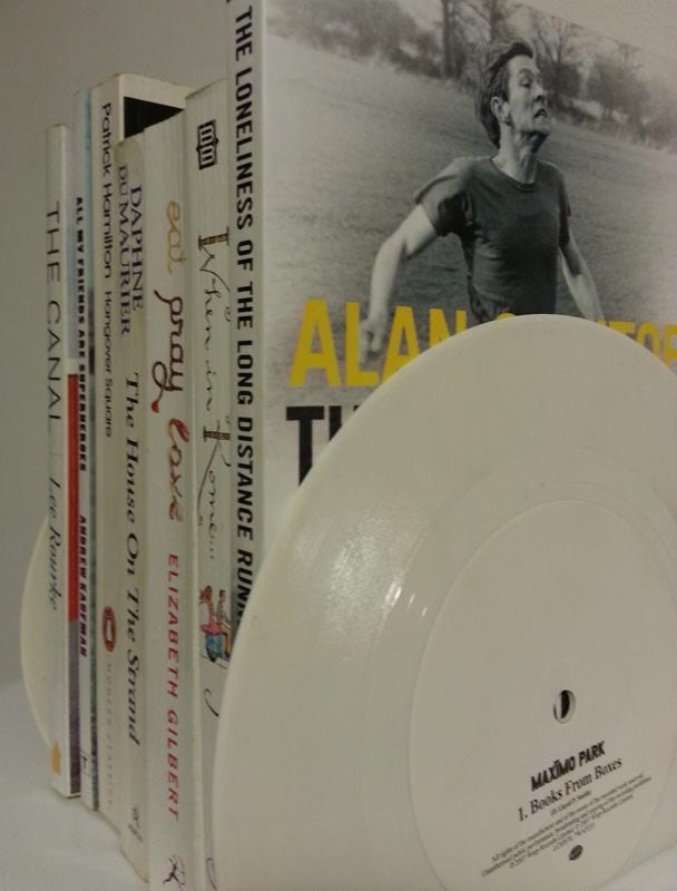 NEW. White vinyl record bookends with bookish titles