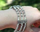 Swarovski Crystals and Antique White Beaded Three Strand Bracelet