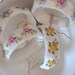 Sanford bone china napkin rings, Made in England, Cottage chic, white with yellow, pink, blue, green flowers, set of four