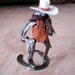 Cowboy Collectable good guy meeting up with the bad guy at high noon.