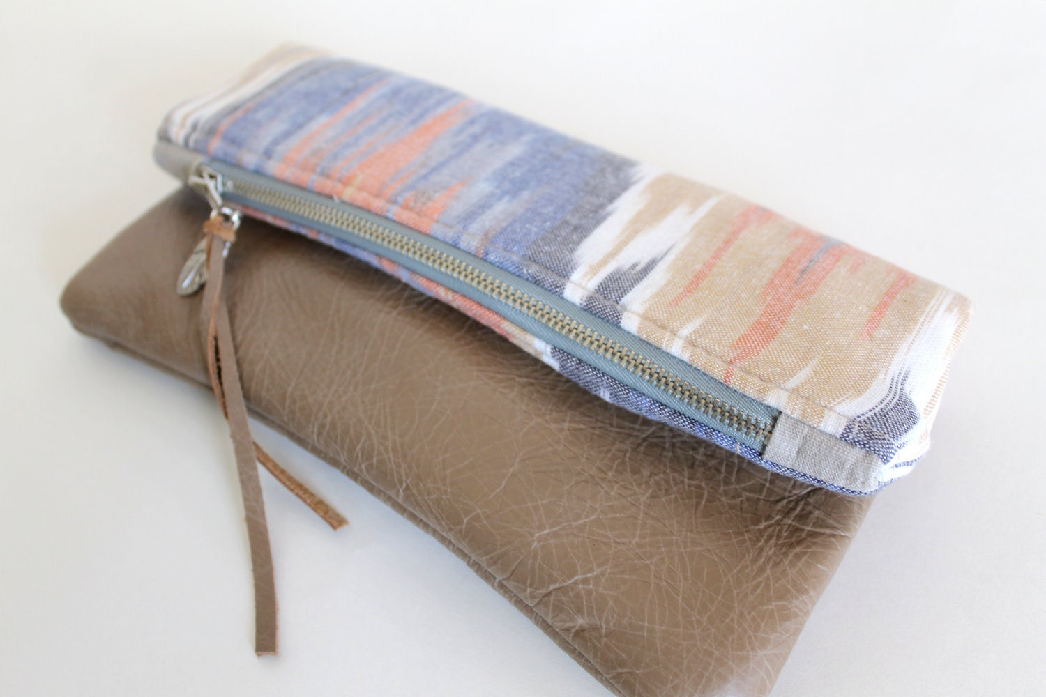 Ikat and leather fold over clutch
